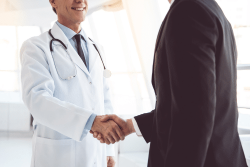 ENT shaking hands with a lawyer